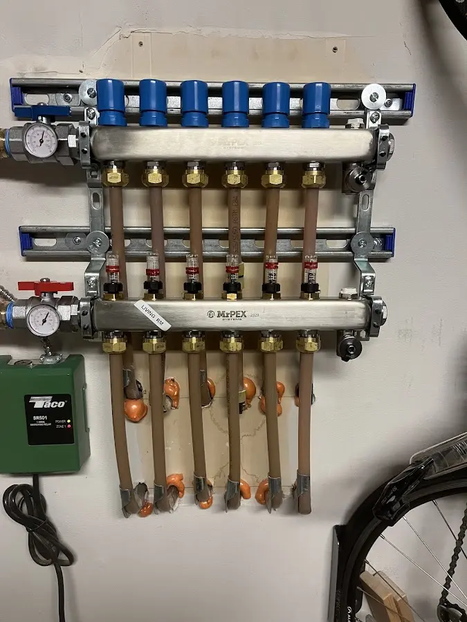 Plumber performing Water Heater Repair at a residential property in Lindenhurst